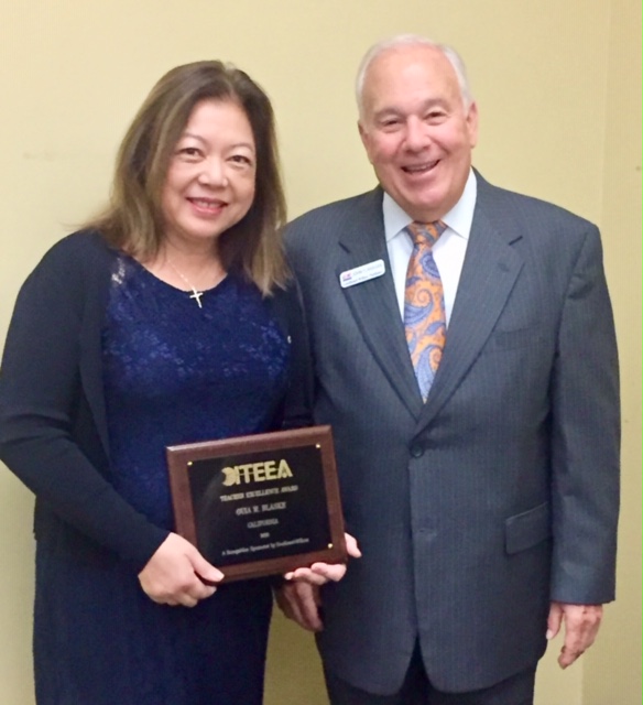 Guia Blaske receiving the ITEEA Teacher Excellence Award plaque
